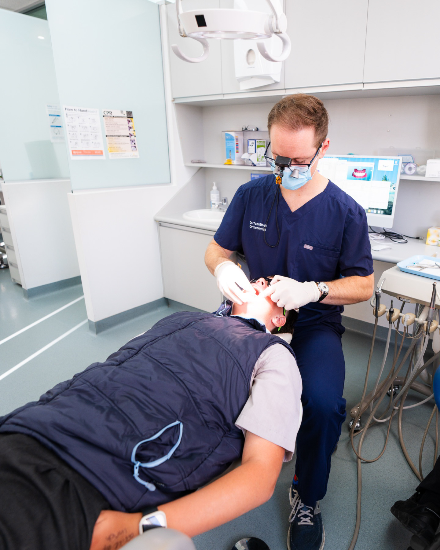 Dr Thomas Ethell examining a teen patient in the Phillip operatory